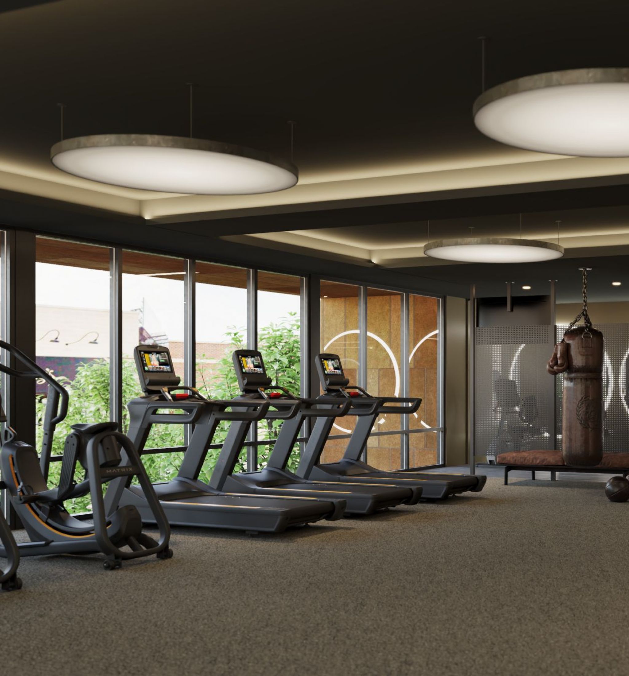 Oberon A gym room featuring multiple treadmills and various exercise equipment arranged for fitness activities.