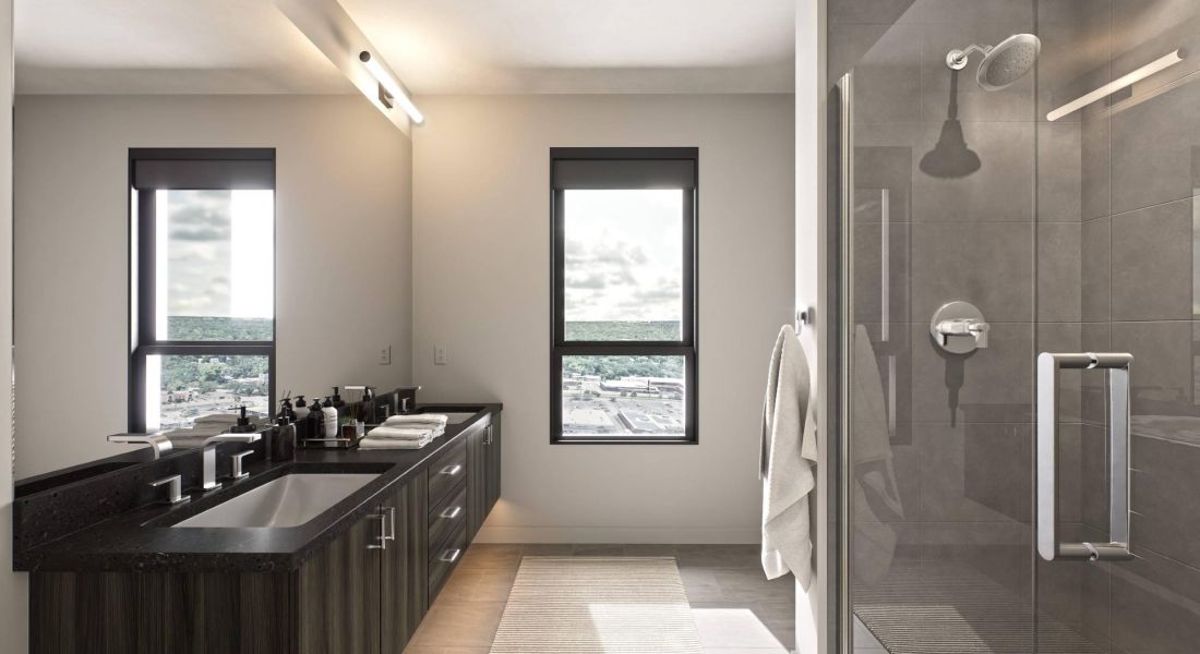 Oberon A sleek modern bathroom featuring a glass shower door and contemporary fixtures.
