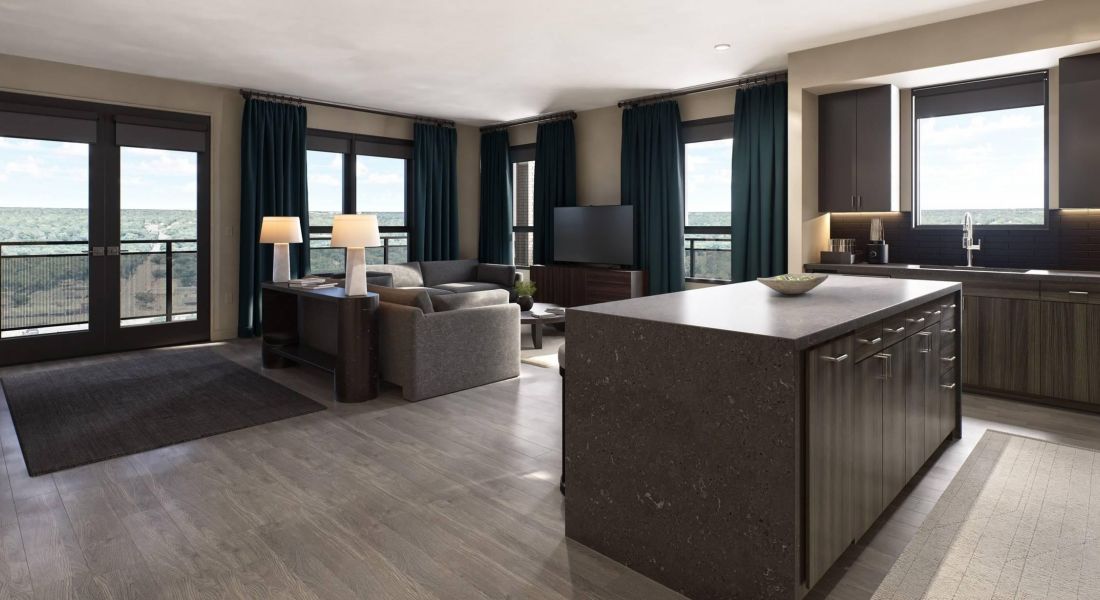 Oberon A modern kitchen and living room design featuring sleek appliances and contemporary furnishings in an open layout.