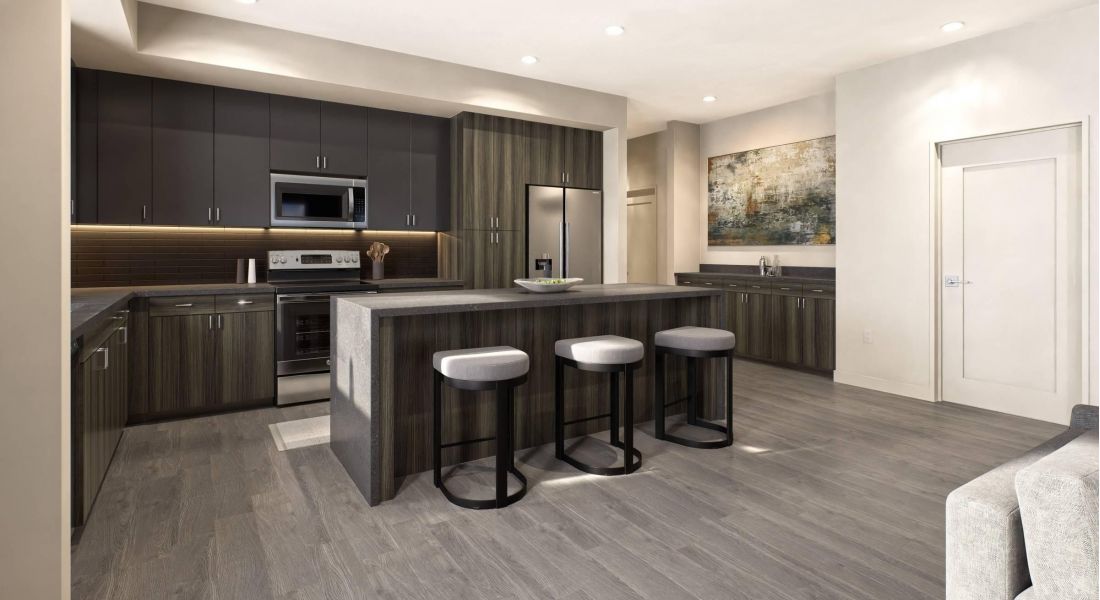 Oberon A modern kitchen featuring sleek cabinetry, a central island, and a stylish bar area for casual dining.