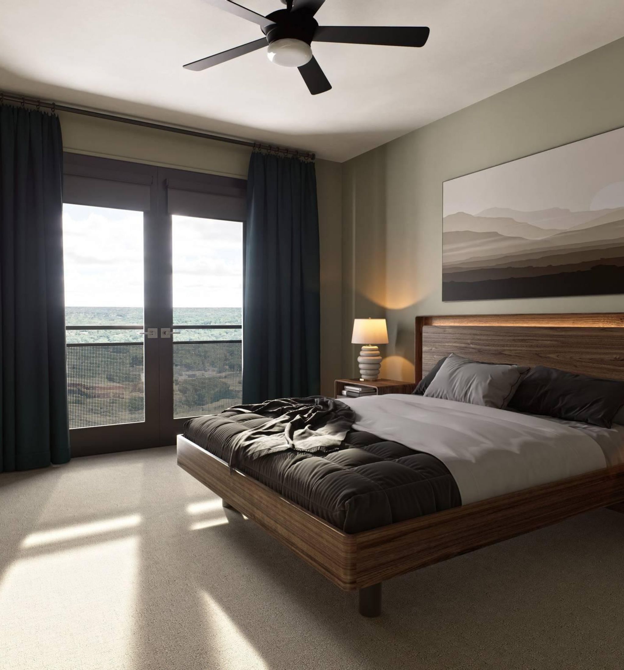 Oberon A cozy bedroom featuring a large bed and a ceiling fan, creating a comfortable and inviting atmosphere.